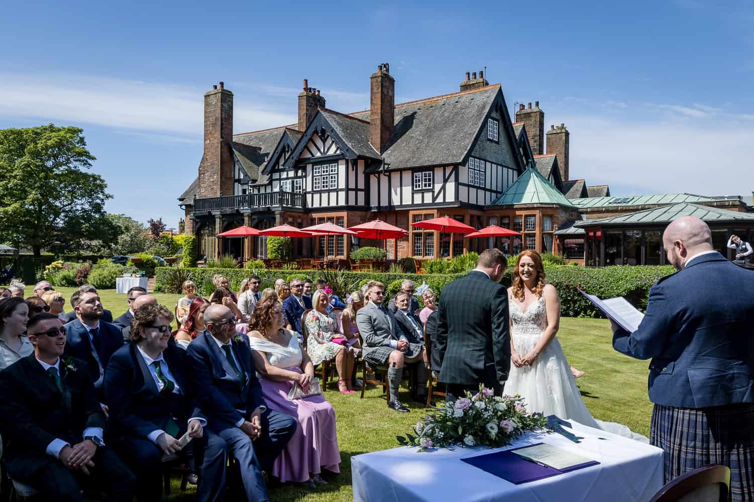 Piersland Wedding Photographer capturing an outdoor wedding ceremony at The Piersland House Hotel in Troon