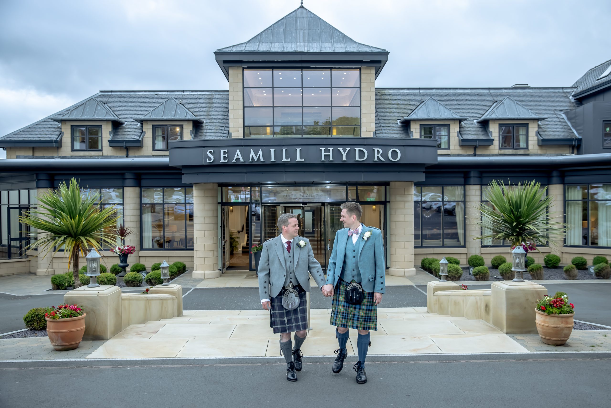 Seamill Hydro Wedding Photographer with newlyweds outside the hotel