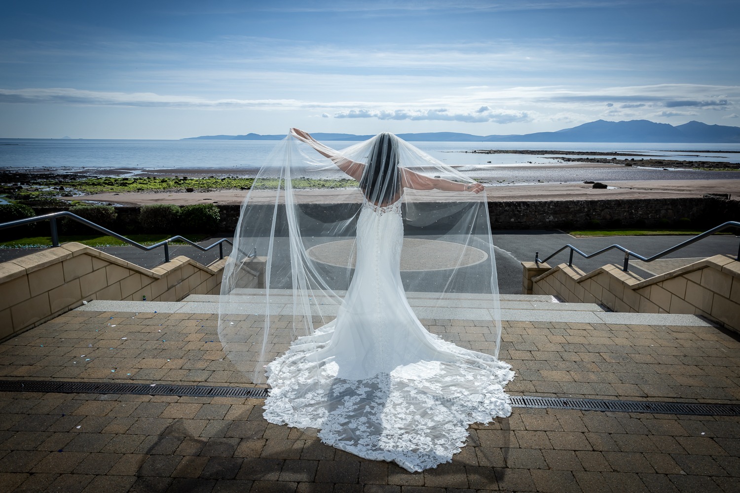 Seamill Hydro Wedding Photographer capturing a bride overlooking the Firth of Clyde towards Arran