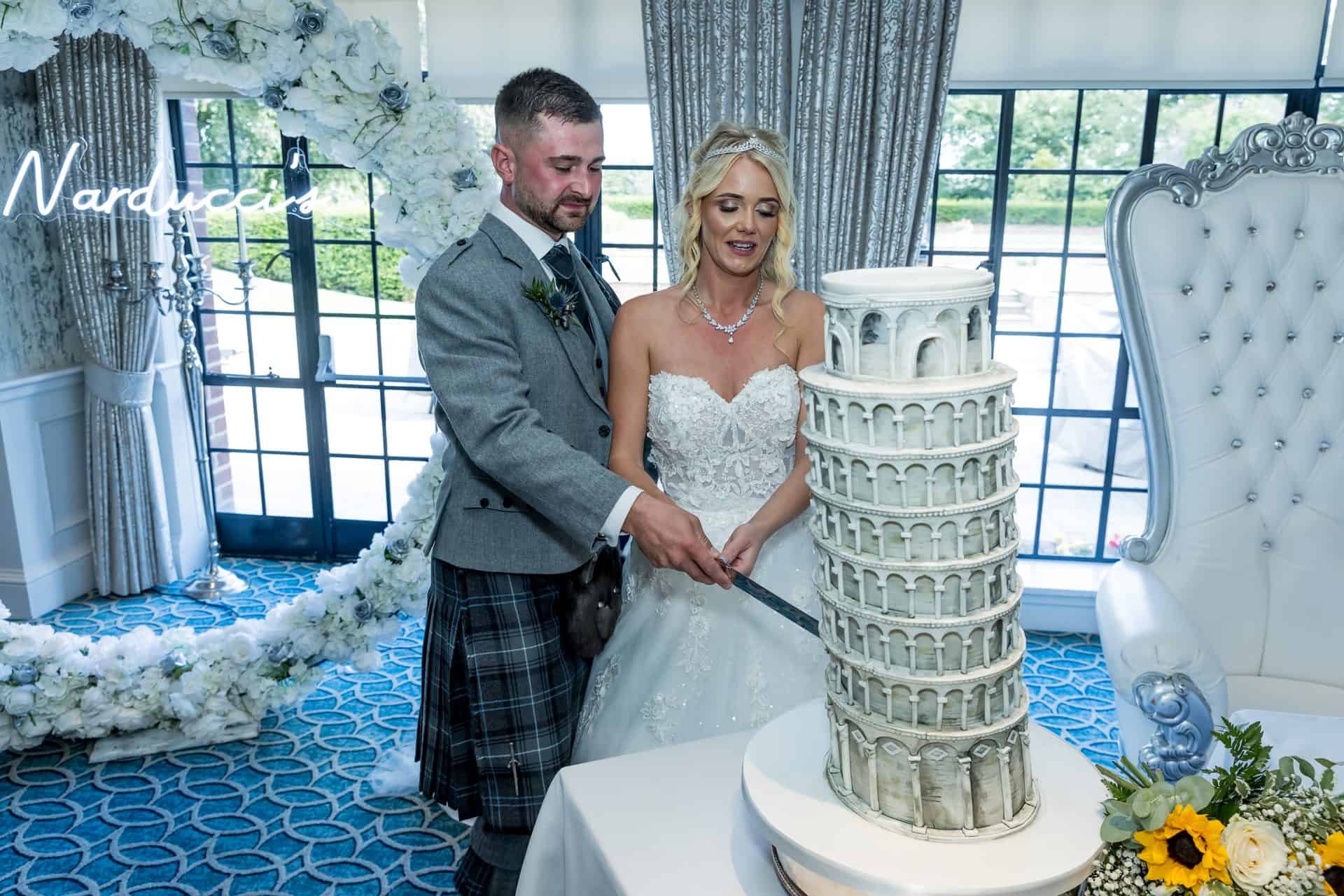 Bride and groom cutting their wedding cake at Western House Hotel