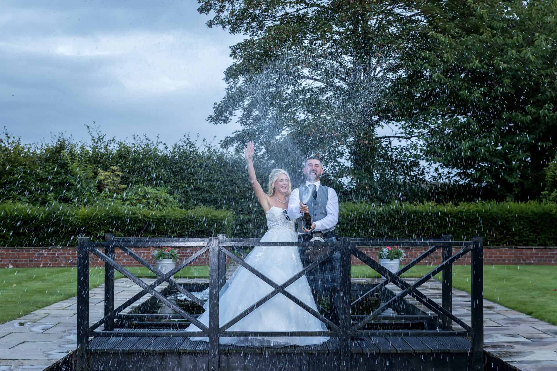 Bride and groom celebrating with champagne at Western House Hotel